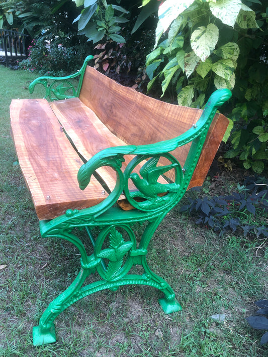 Garden bench in cast iron and rough log wood for home garden and balcony decor